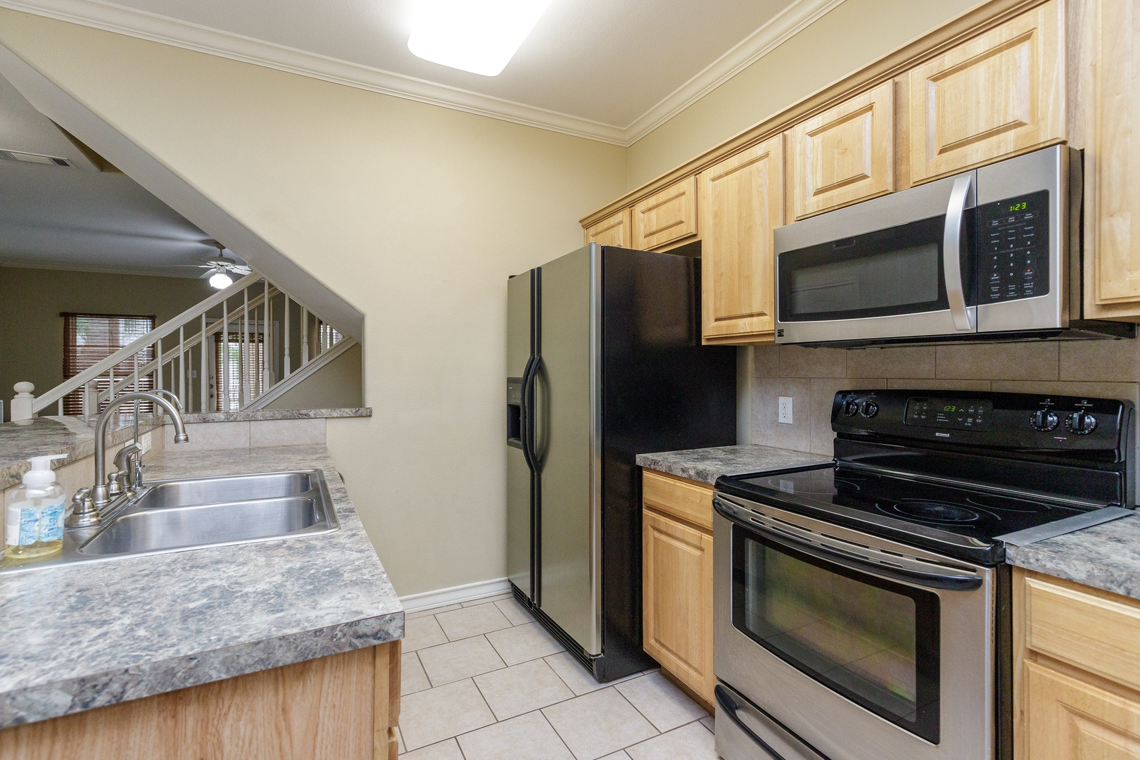 The breezy, open kitchen offers loads of space & all the comforts of home