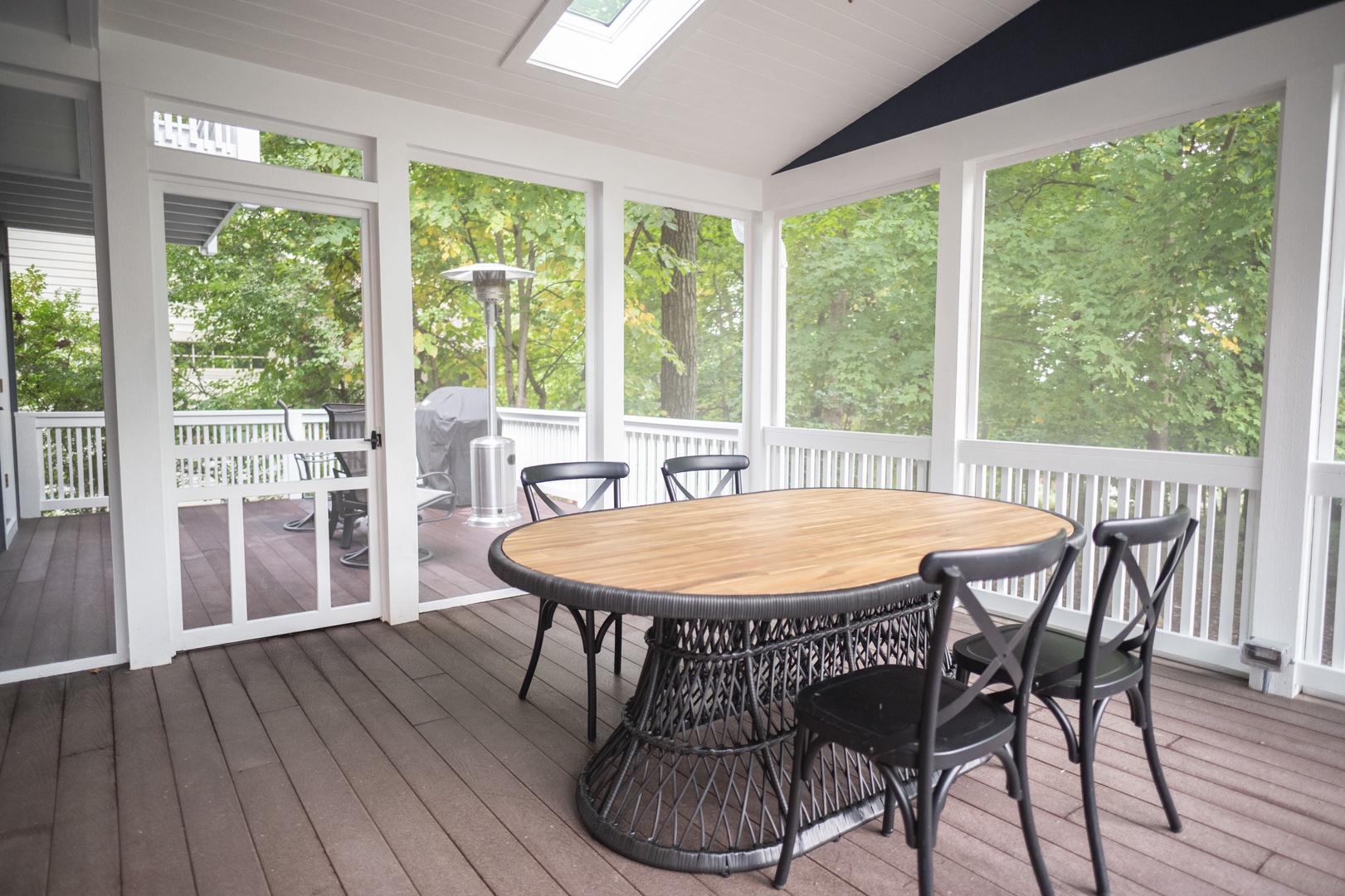 Enjoy a meal on the screened-in porch