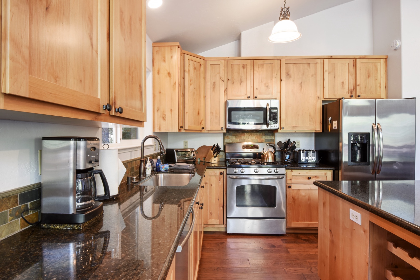 Kitchen with drip coffee maker, toaster oven, blender, and more