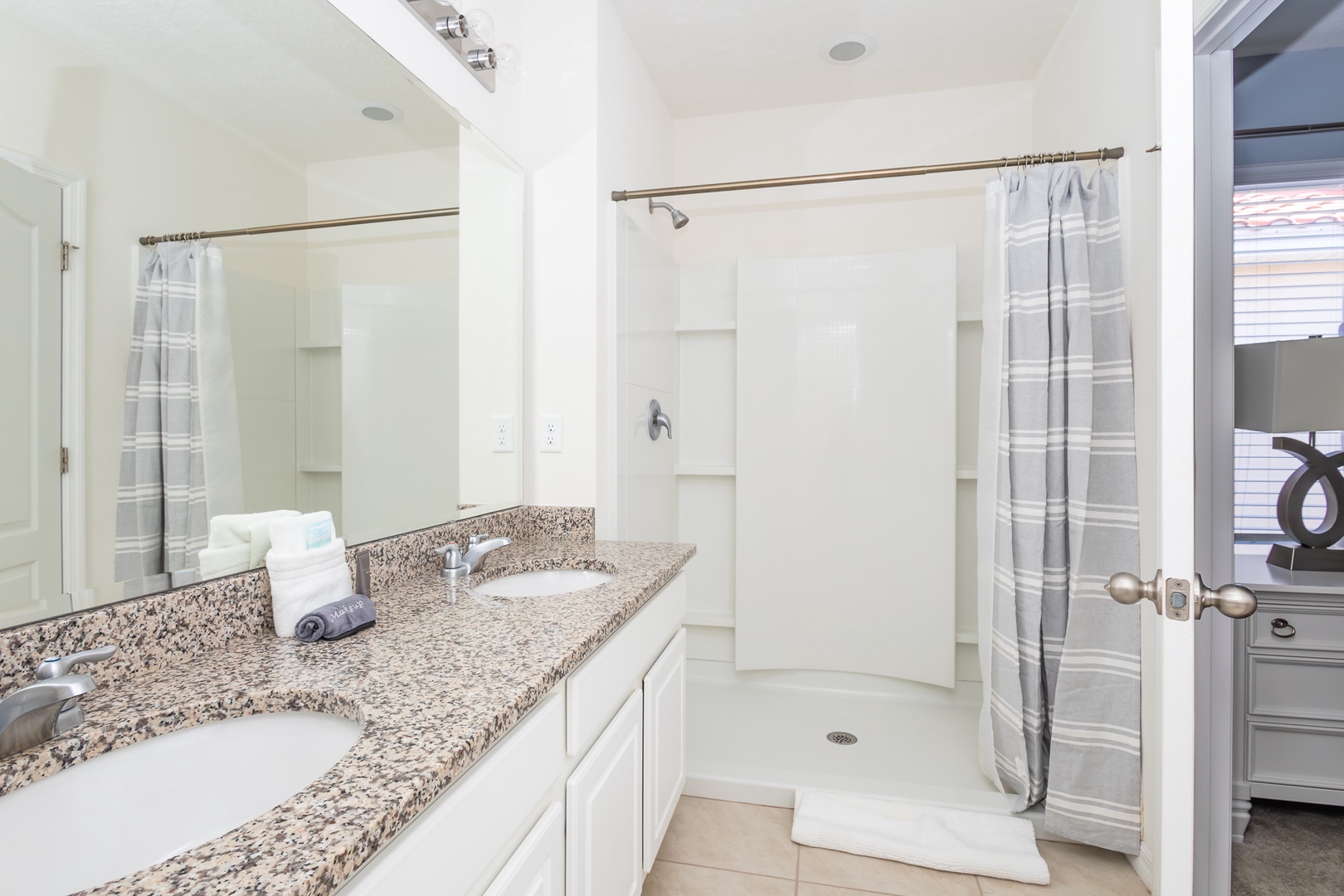 This ensuite bath features a double vanity and walk-in shower