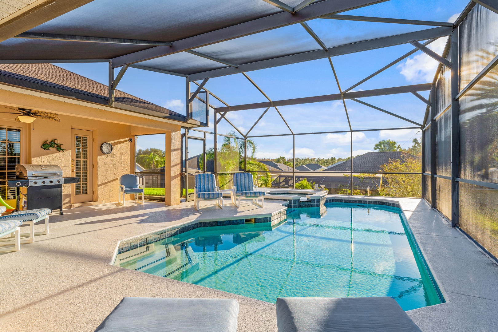 Private screened in pool with outdoor seating