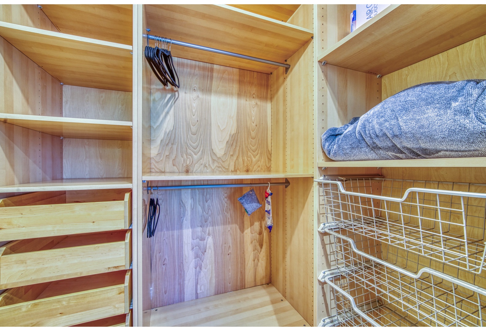 Keep clothes & bags neatly tucked away in the master closet