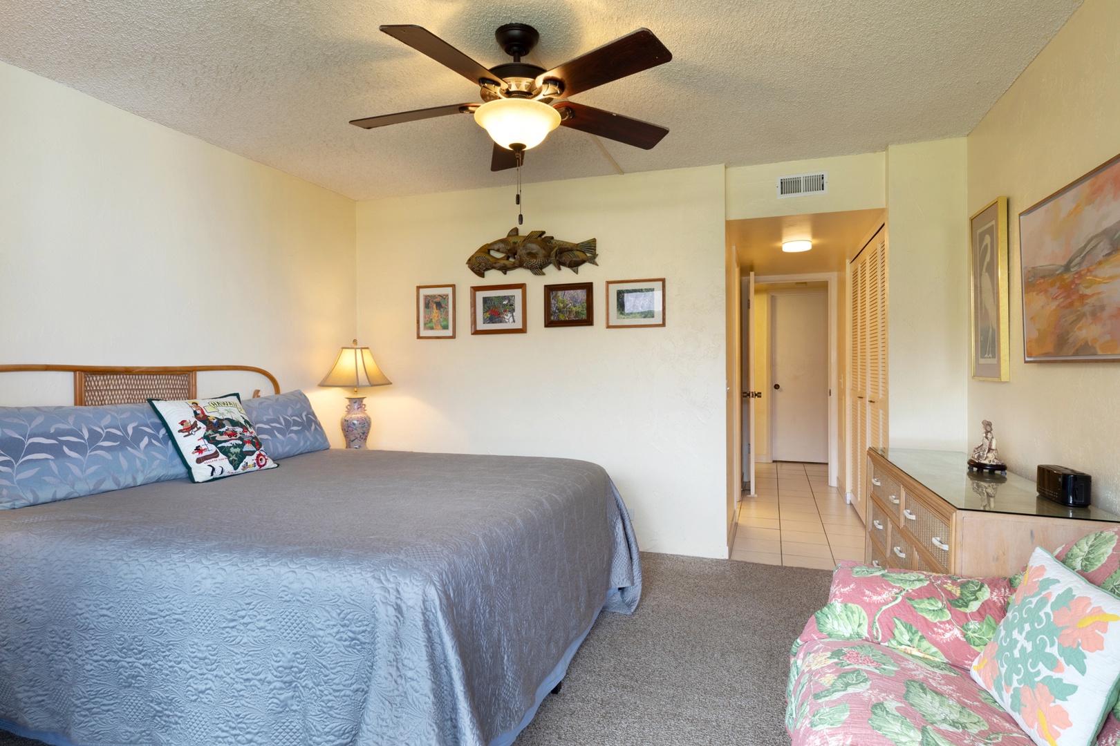 Primary Bedroom with King bed, lanai access, and ensuite