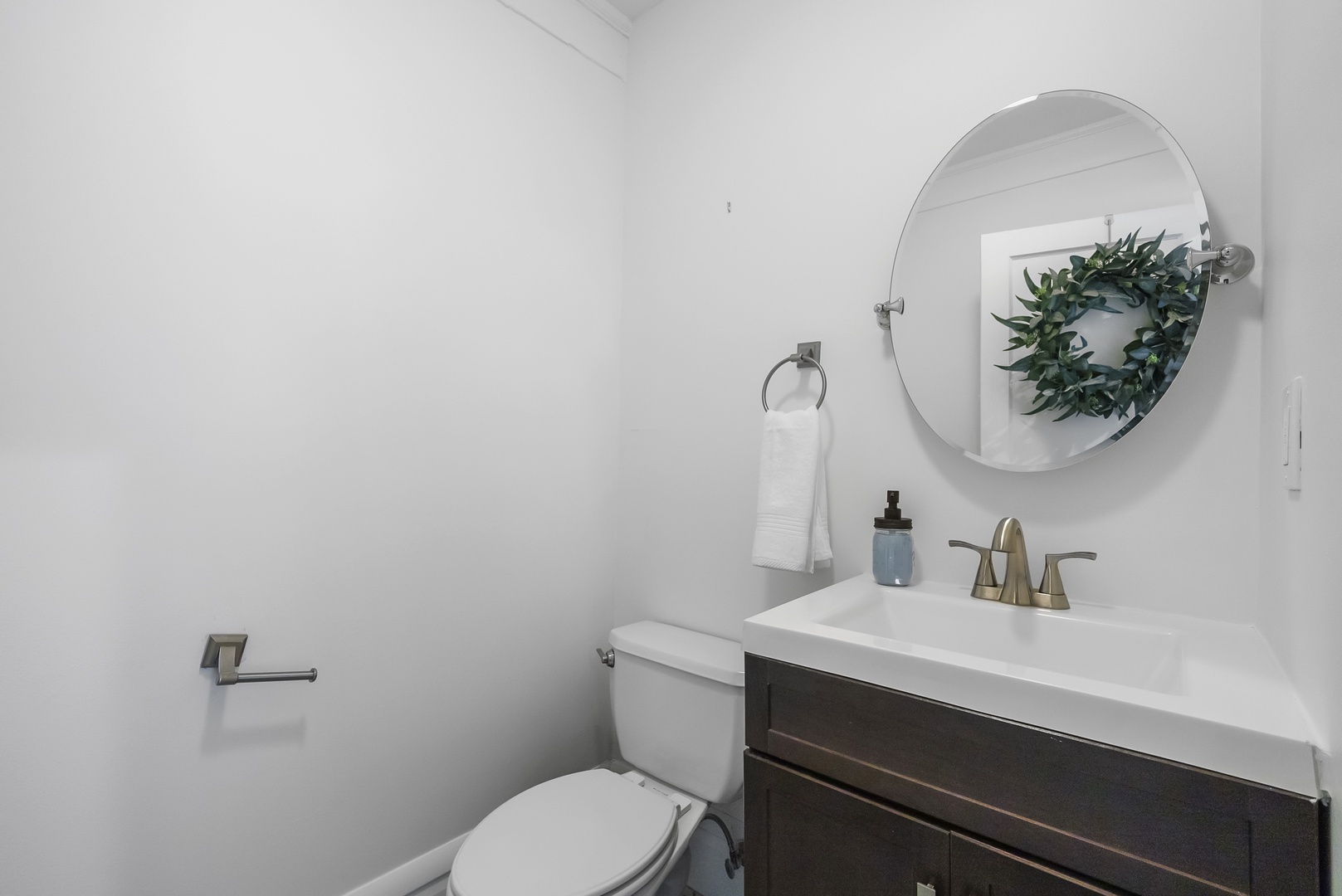 A convenient powder room is located on the first floor