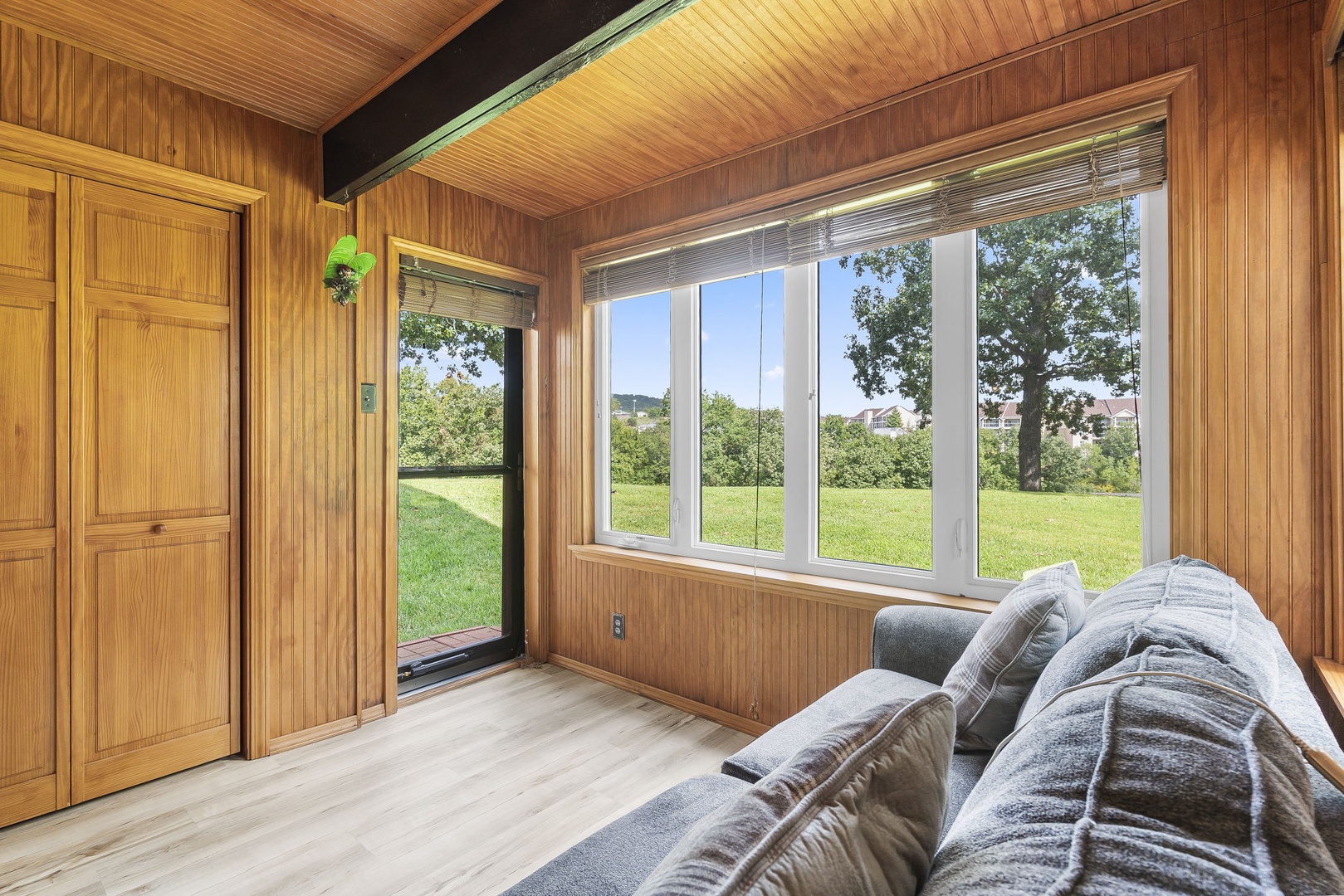 Head into the sunroom & relax with tranquil nature views on the queen sleeper sofa