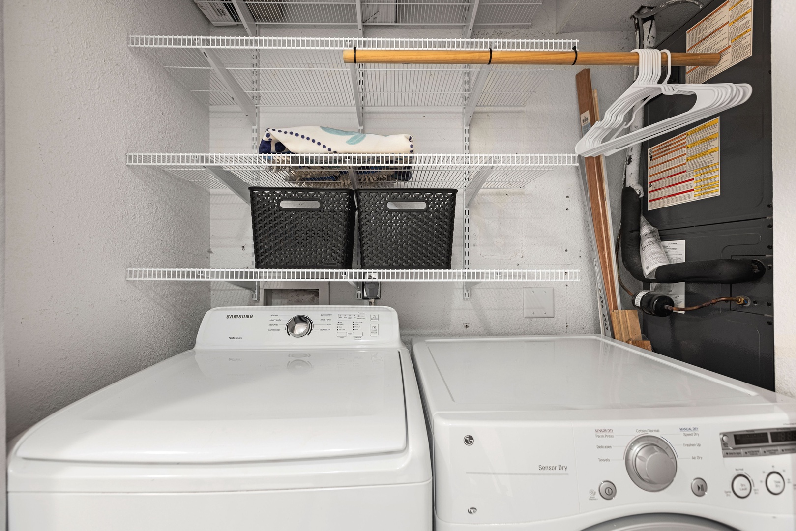 The first-floor full bath includes a single vanity, glass shower, & laundry