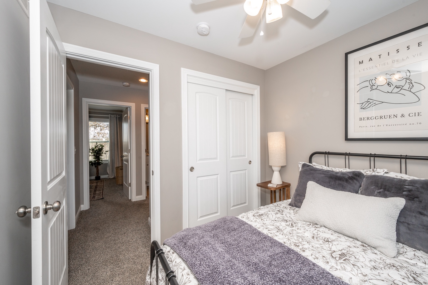 The final bedroom on the main level offers a full bed & ceiling fan
