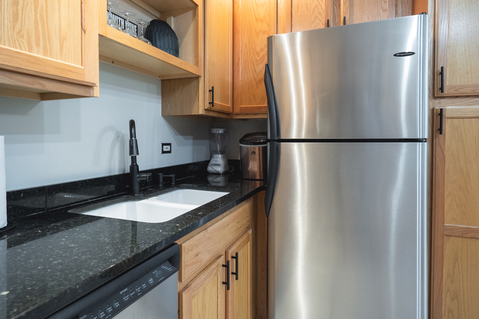The kitchen offers ample storage space & all the comforts of home