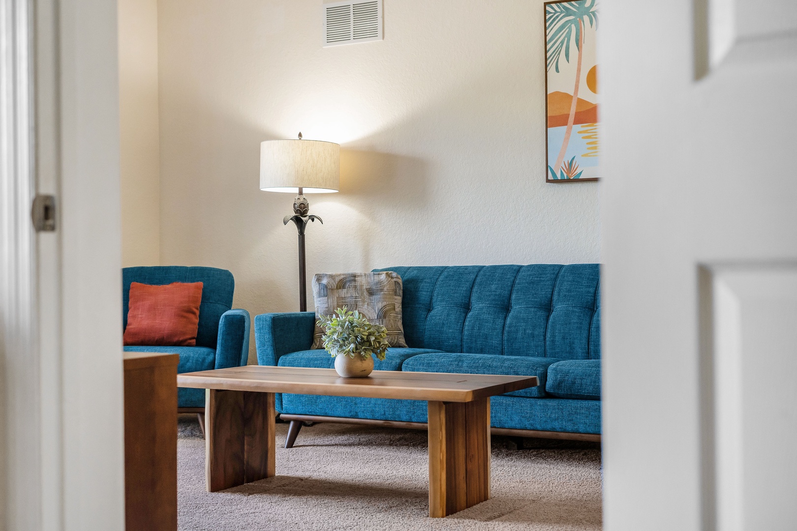 Living room with cozy seating and Smart TV