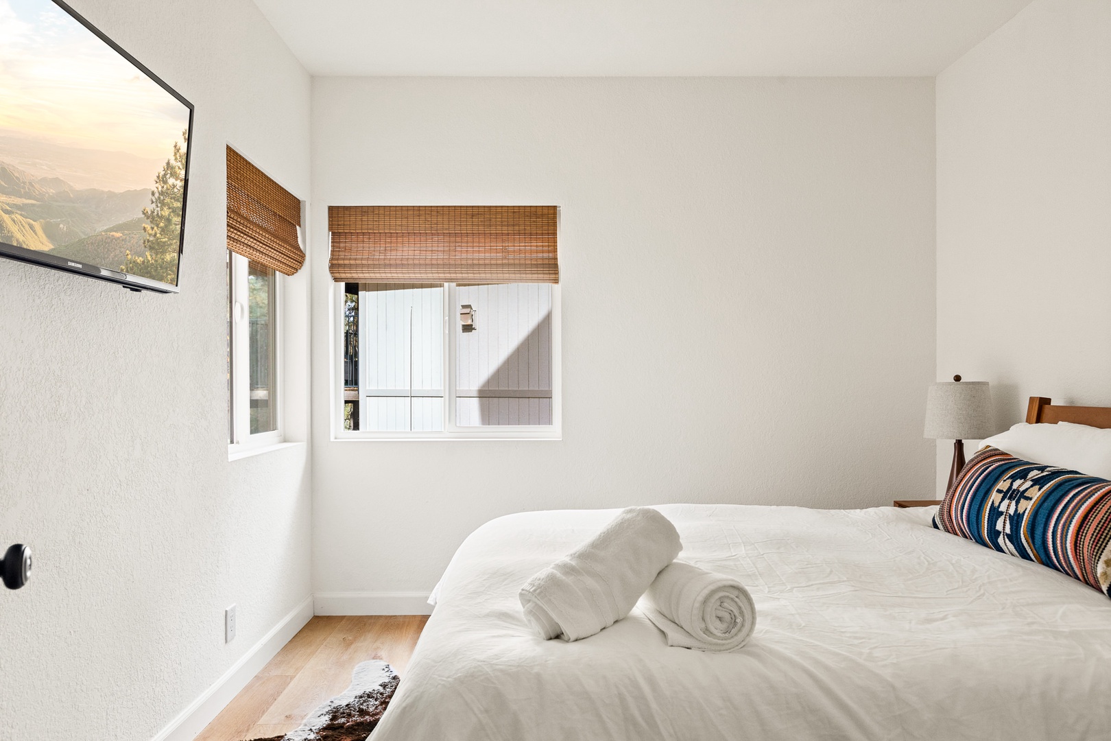 This cozy 1st floor bedroom includes a queen bed & Smart TV
