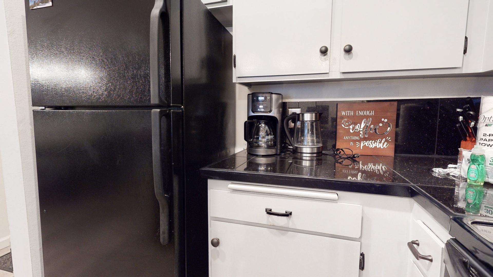 Kitchen with drip coffee maker, toaster, slow cooker, blender, and more