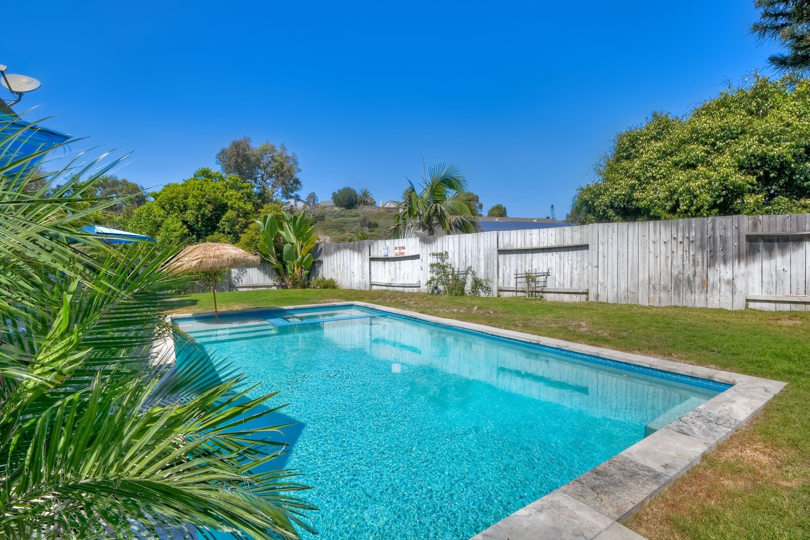 Backyard with ample seating and private pool