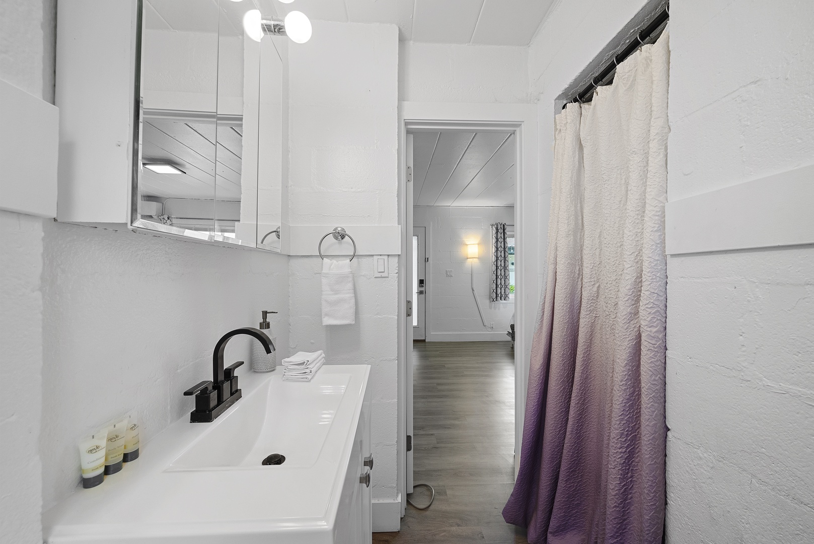 A chic single vanity & shower await in the full bathroom