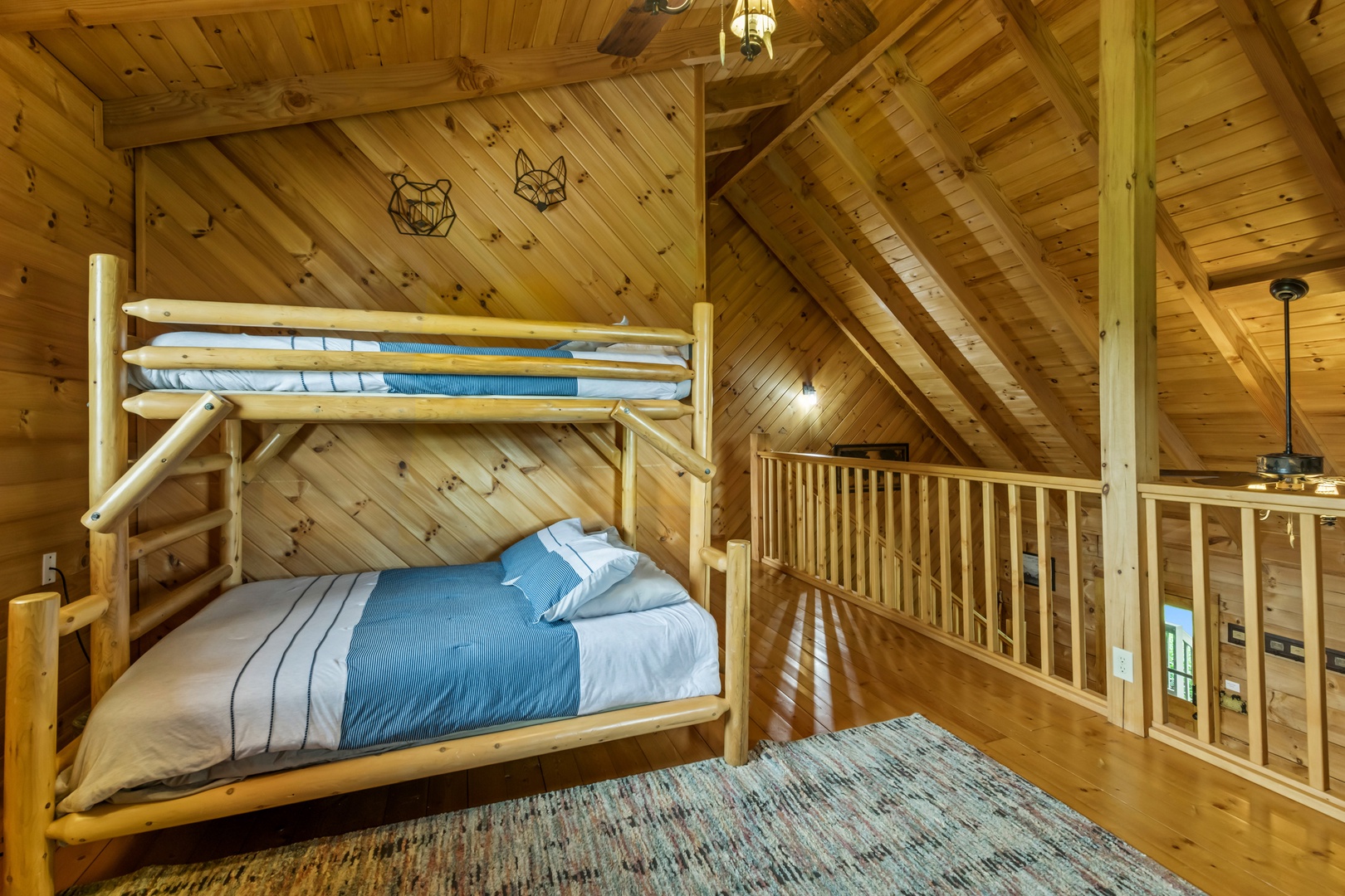 The loft features twin-over-full bunks & a cozy seating area with smart TV