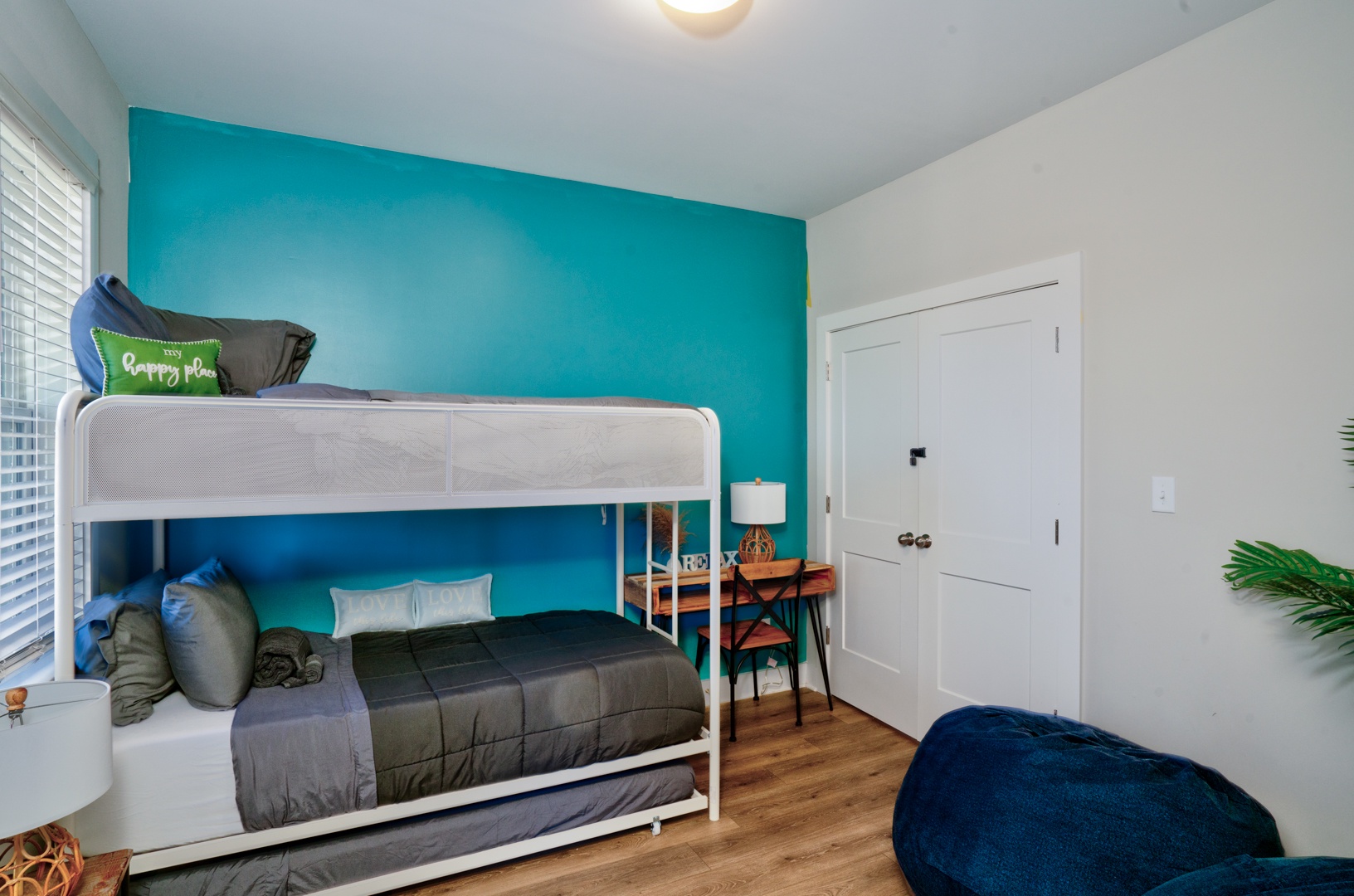 The 1st floor bunk room offers a twin-over-twin bunkbed with twin trundle