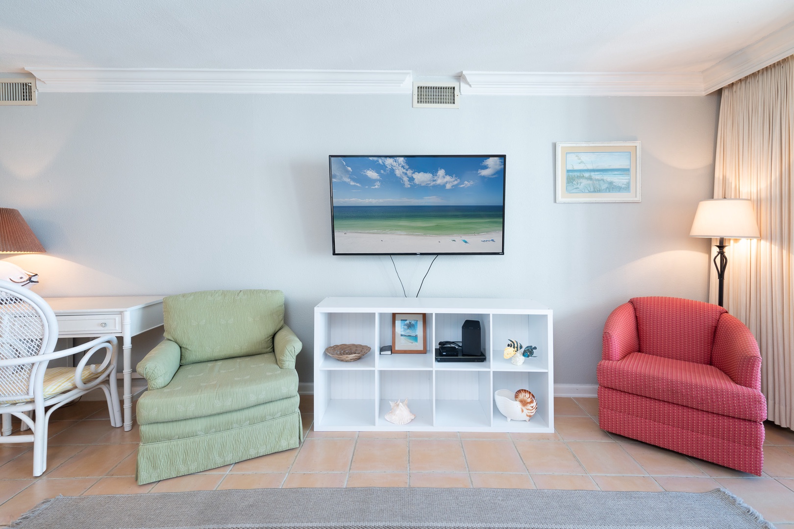 Living room with sofa sleeper, Smart TV, and balcony