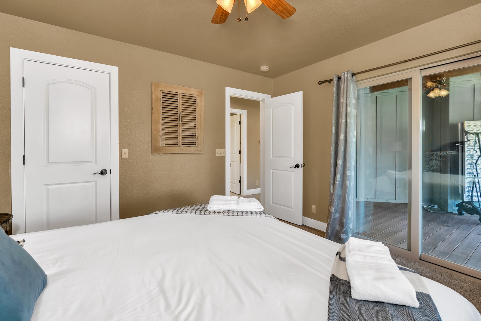 The lower-level king bedroom includes a Smart TV & access to the deck