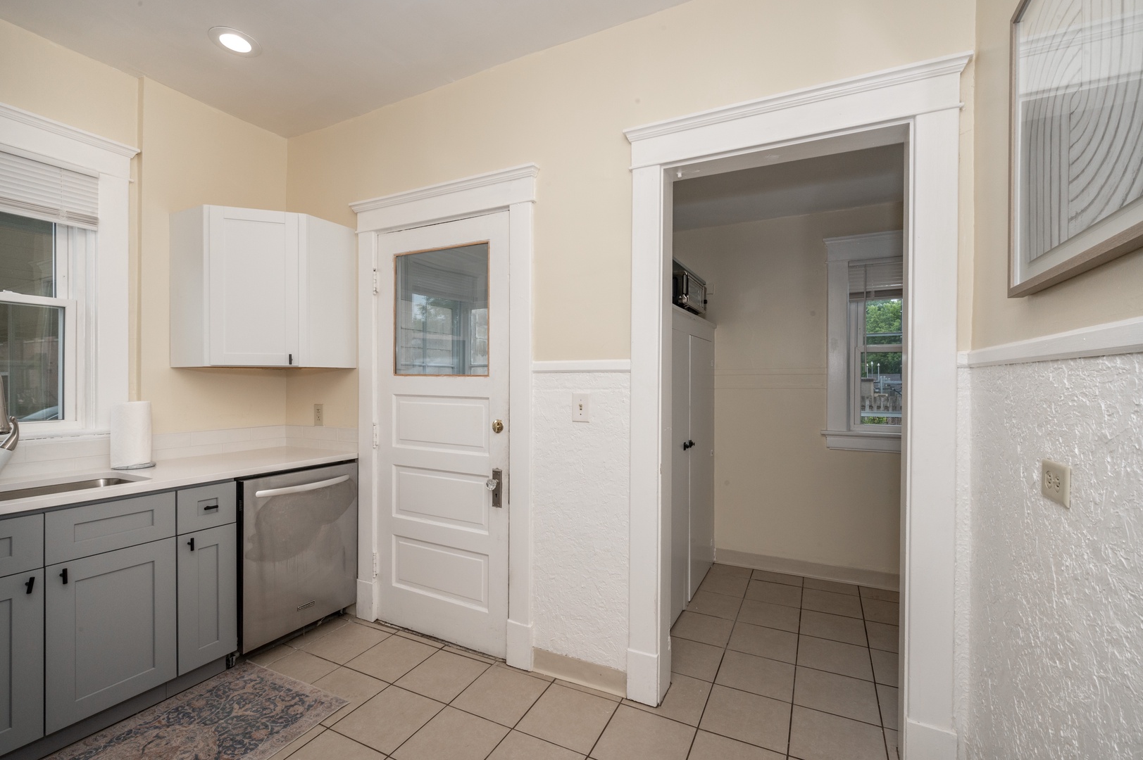 Guests can find additional storage and space off the kitchen