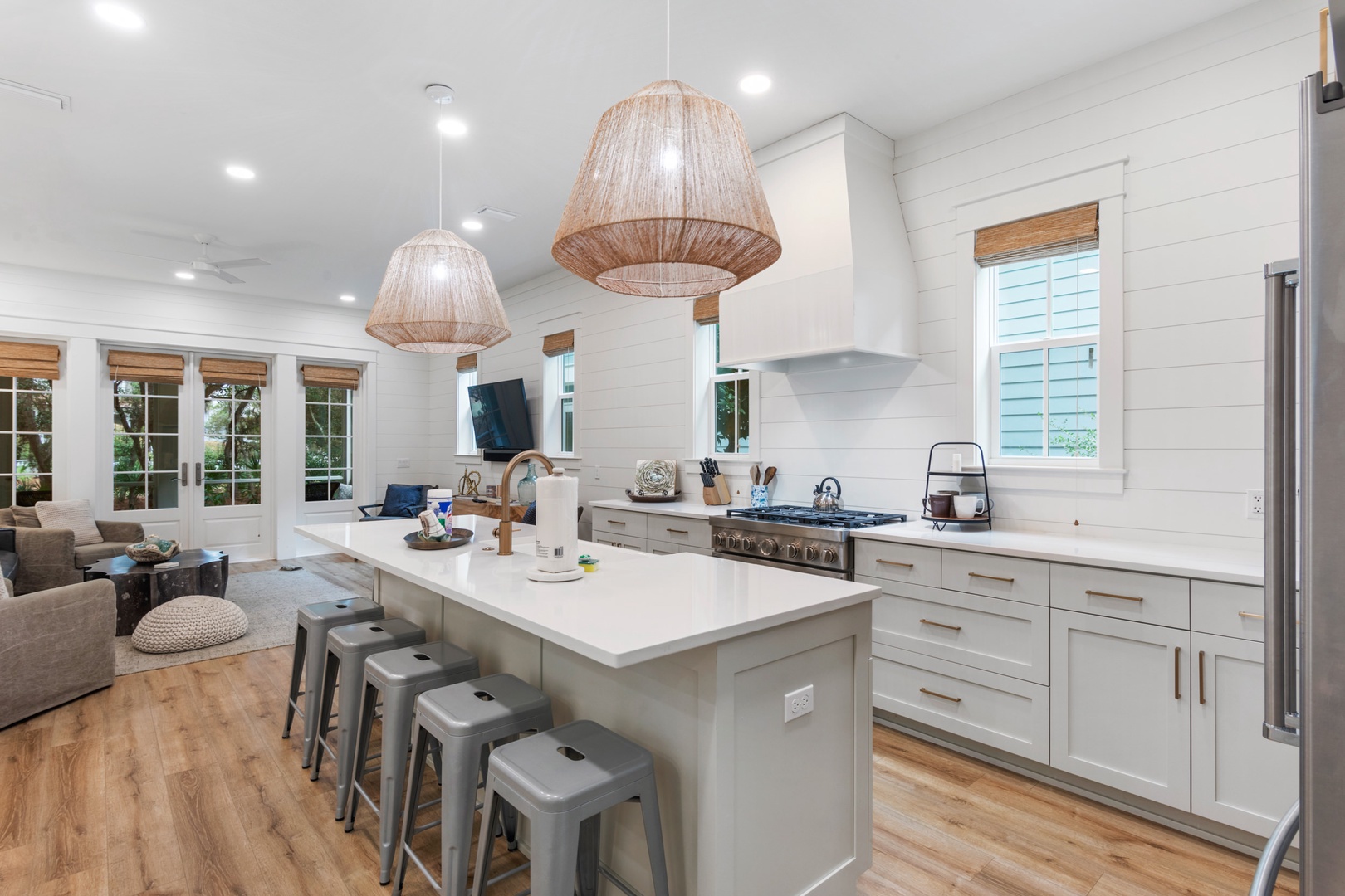 Kitchen is equipped with bar stool seating