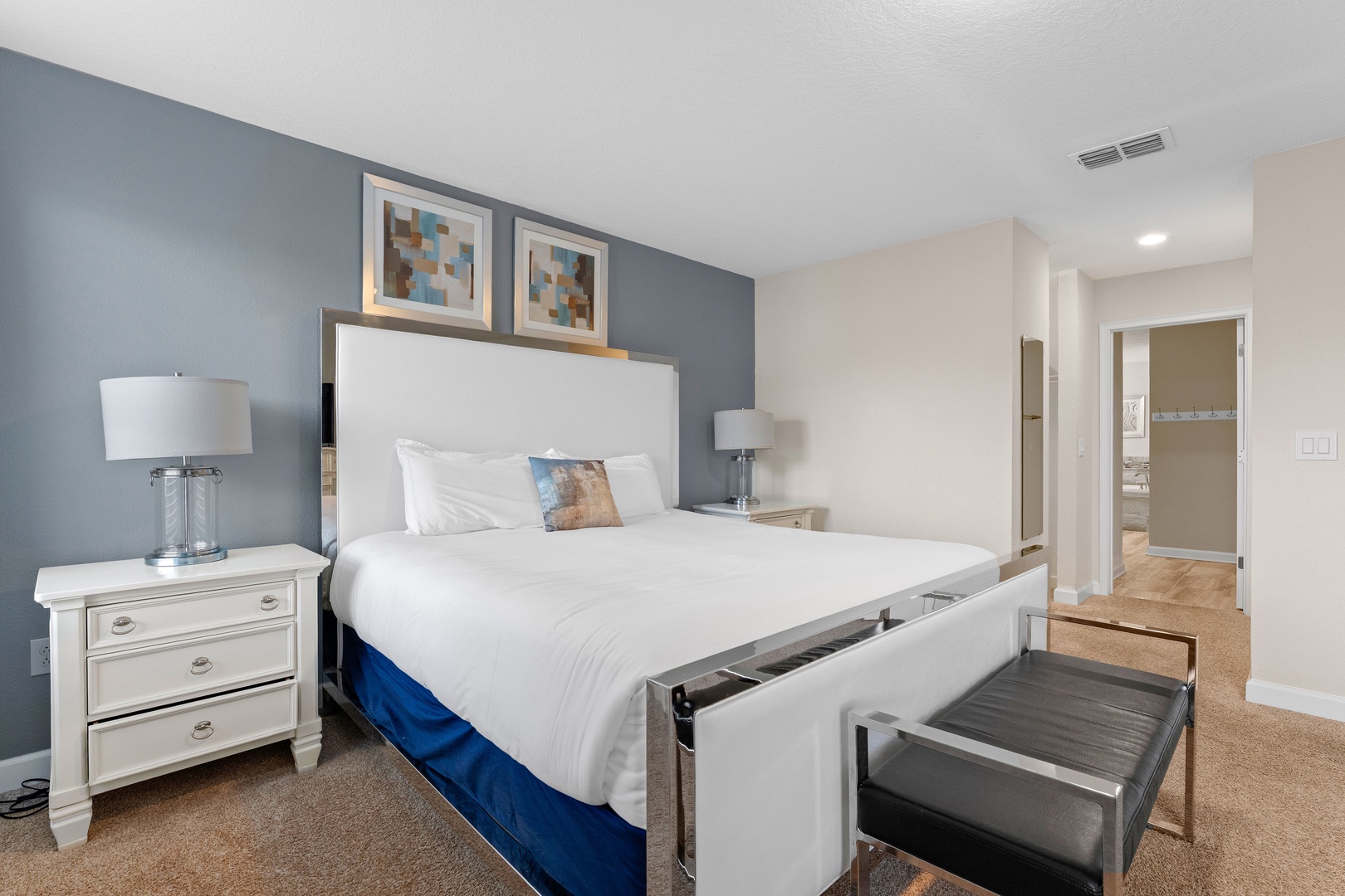 Bedroom 4 with king bed, TV, and ensuite