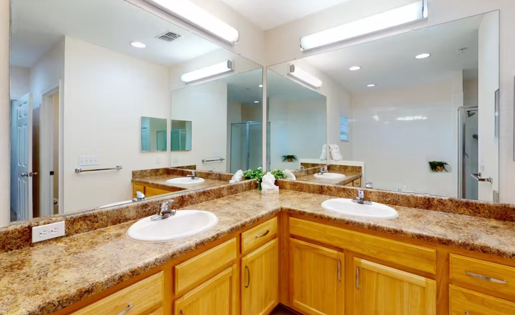 Spacious Jack & Jill bath with double vanity, walk-in shower, and tub