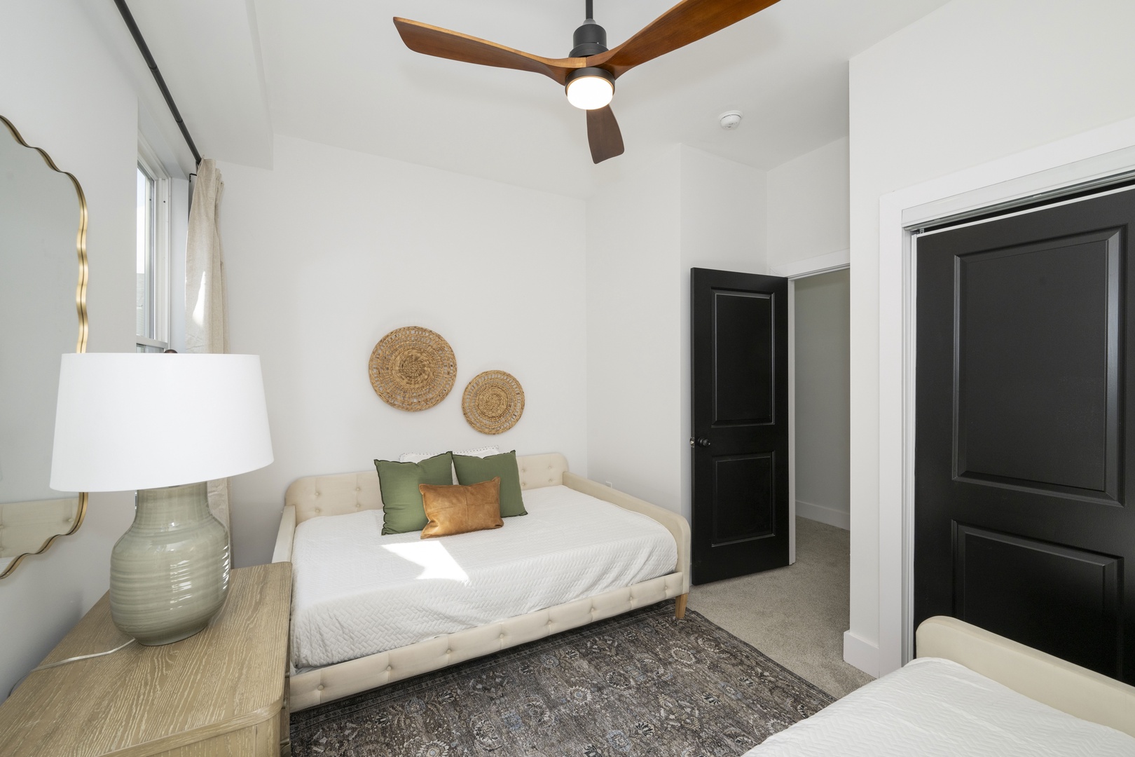 A pair of plush full-sized daybeds awaits in the second bedroom retreat