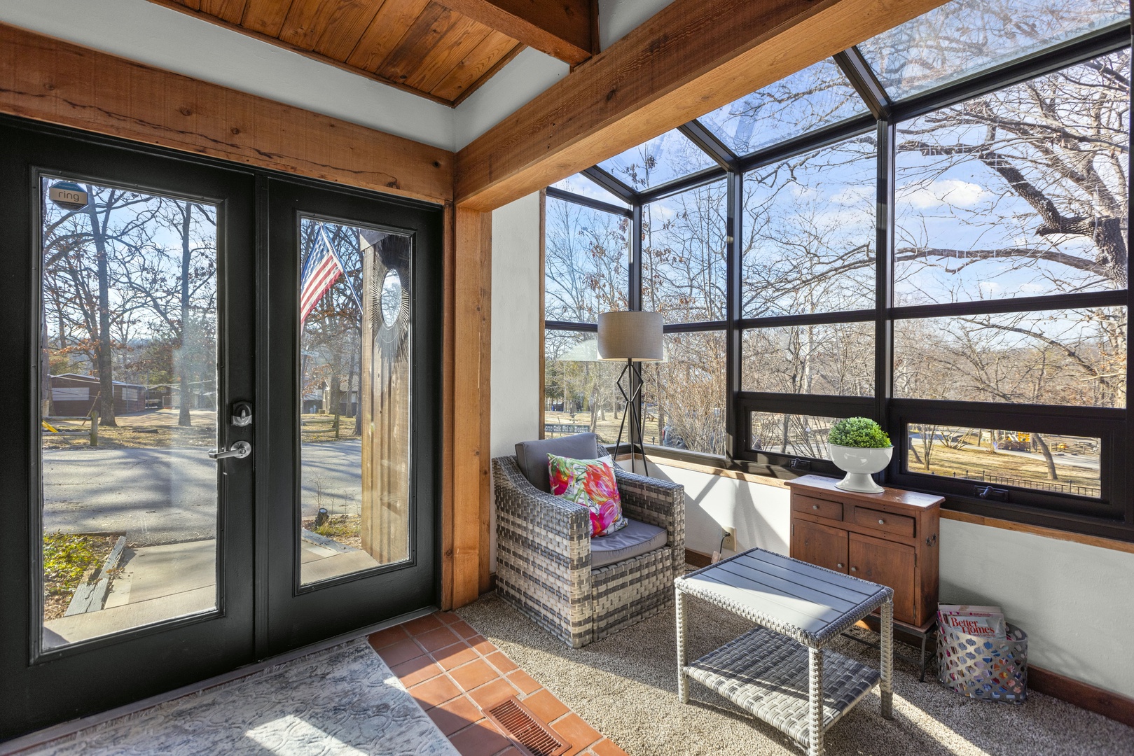 Sip morning coffee or play cards in the sunroom with stunning lake views