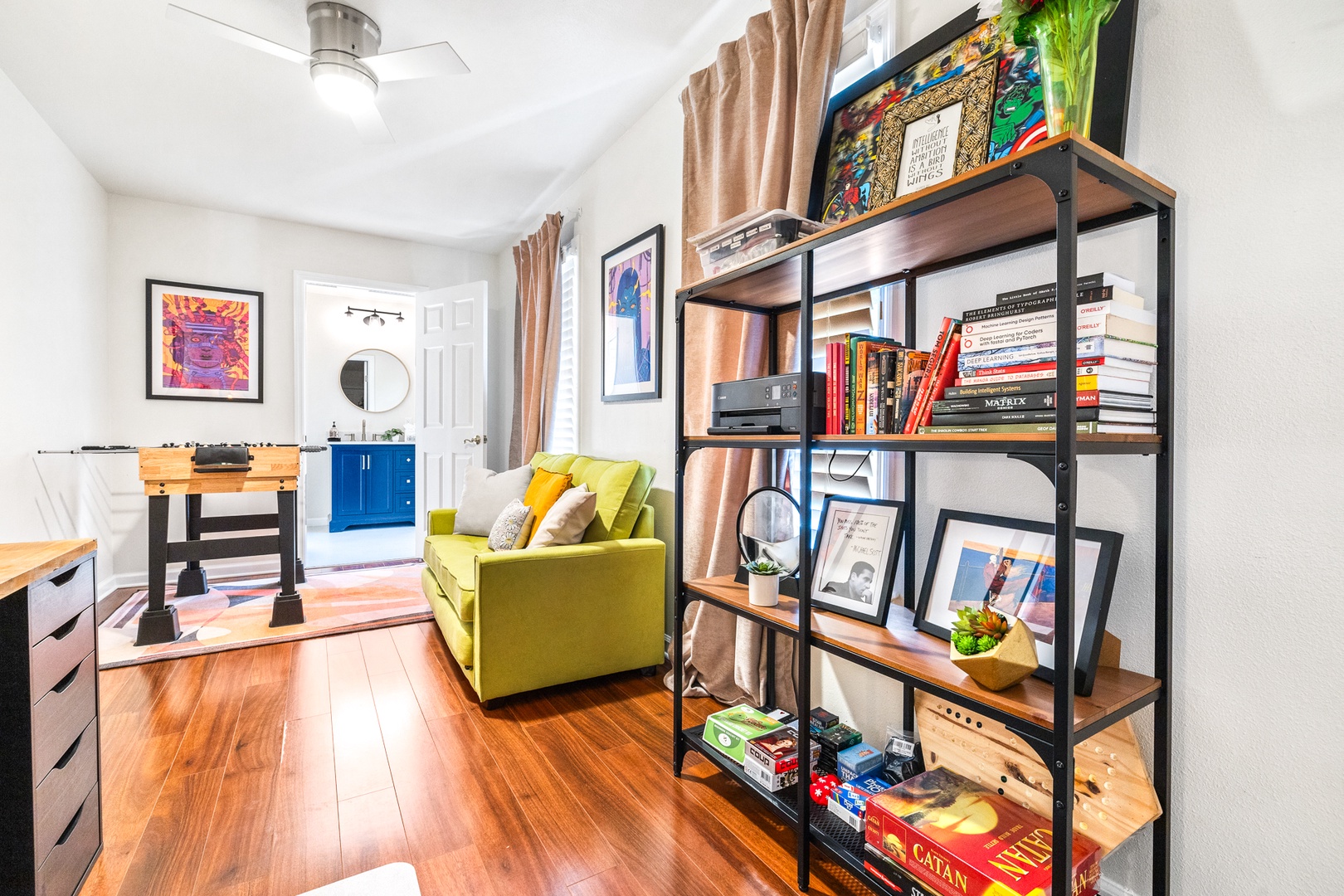 Game room with sofa sleeper, foosball, and shared ensuite