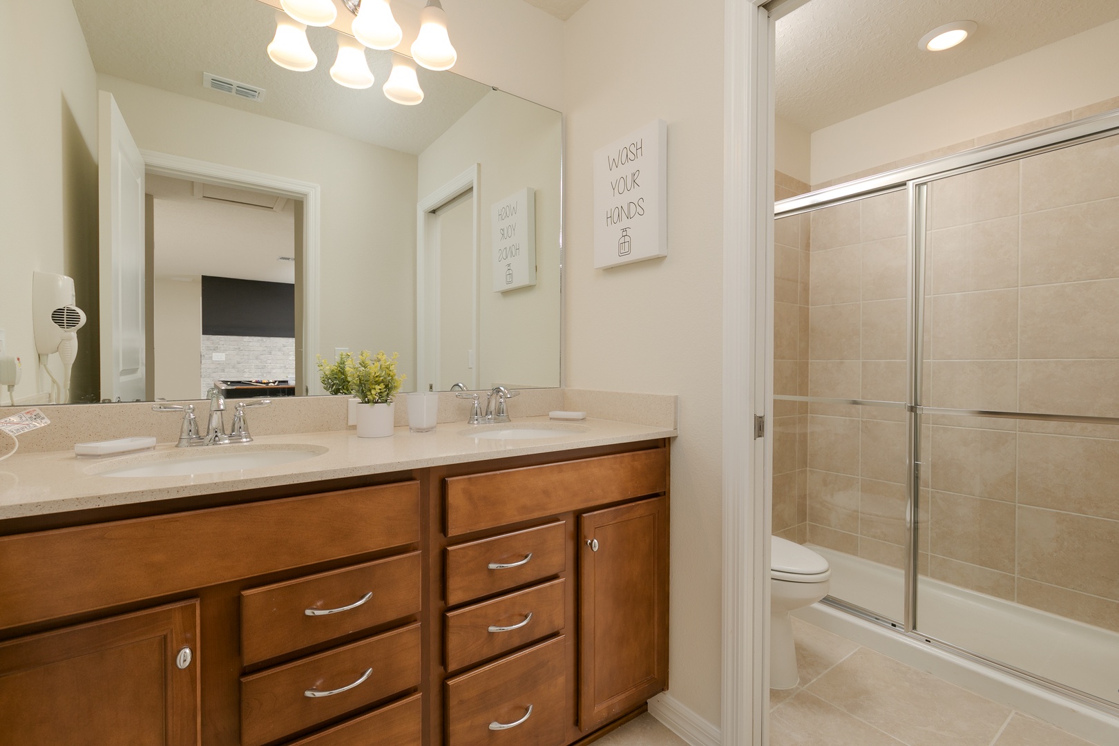 This 2nd floor full bathroom offers a double vanity & glass shower