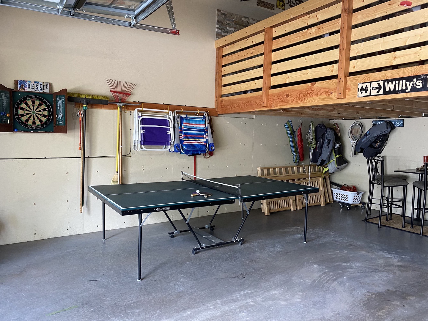 Game room with ping pong table in garage