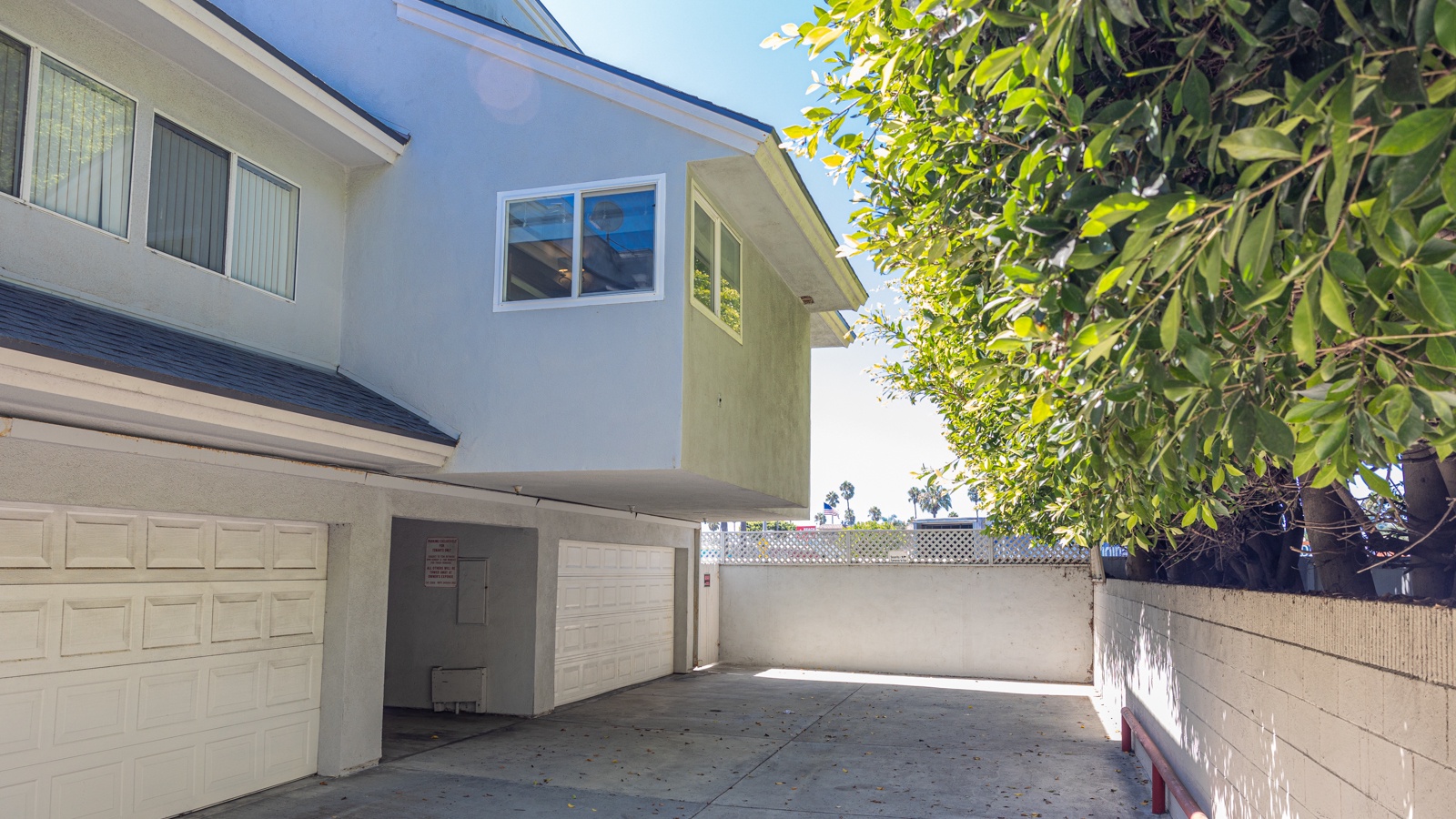 Enjoy parking for 2 vehicles in the shared attached garage