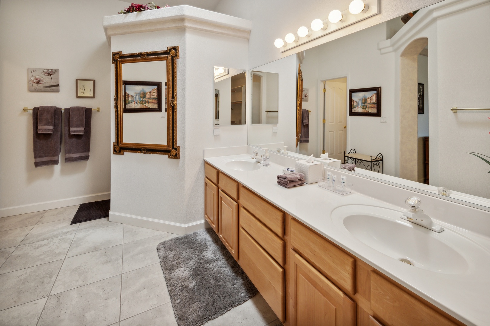 A double vanity & shower await in this luxe ensuite