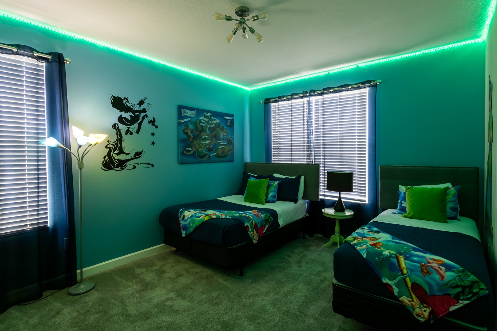 This bedroom’s twin bed, full bed, & smart TV will have you believing in fairies!