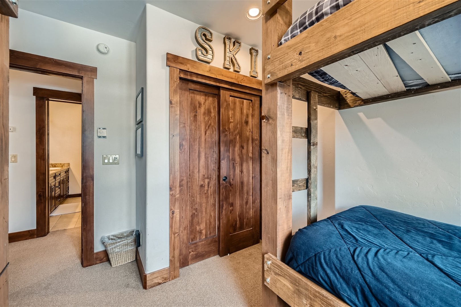 The final bedroom includes a pair of twin-over-twin bunkbeds & Smart TV