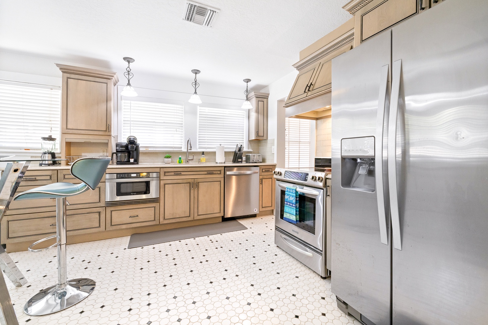 The breezy kitchen offers ample storage space & all the comforts of home