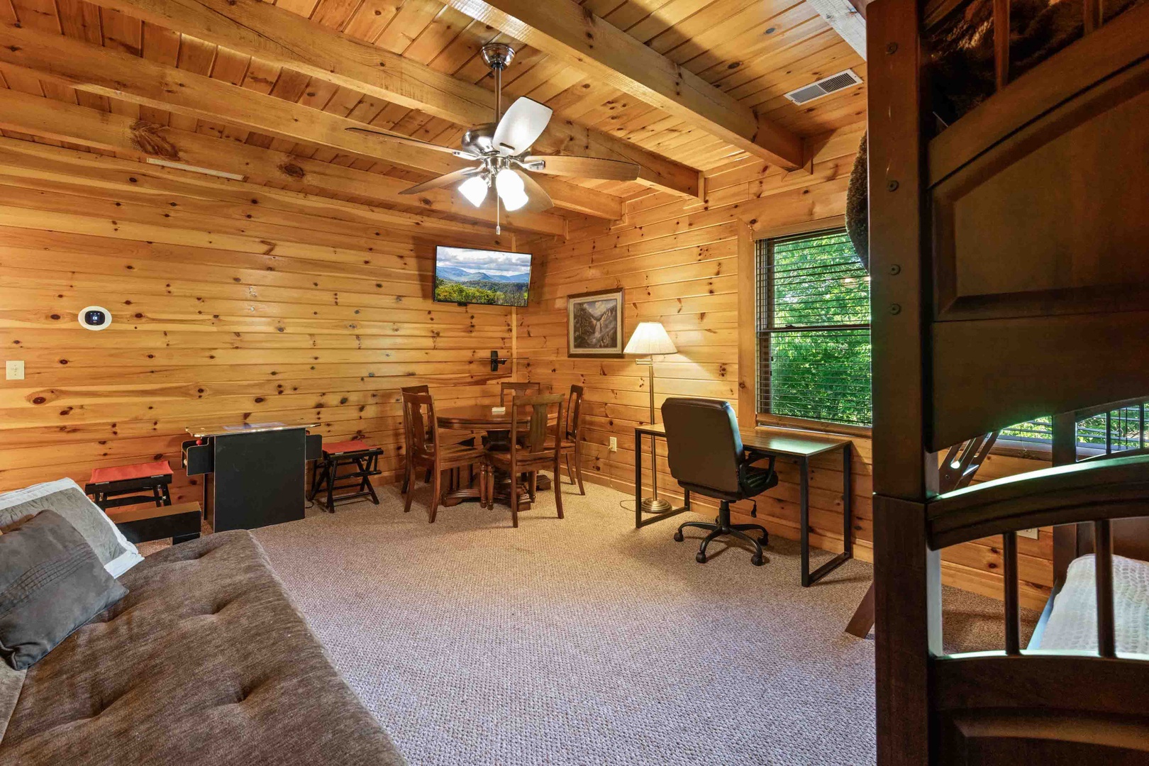 Loft with arcade game, twin/twin bunk bed, and queen size futon