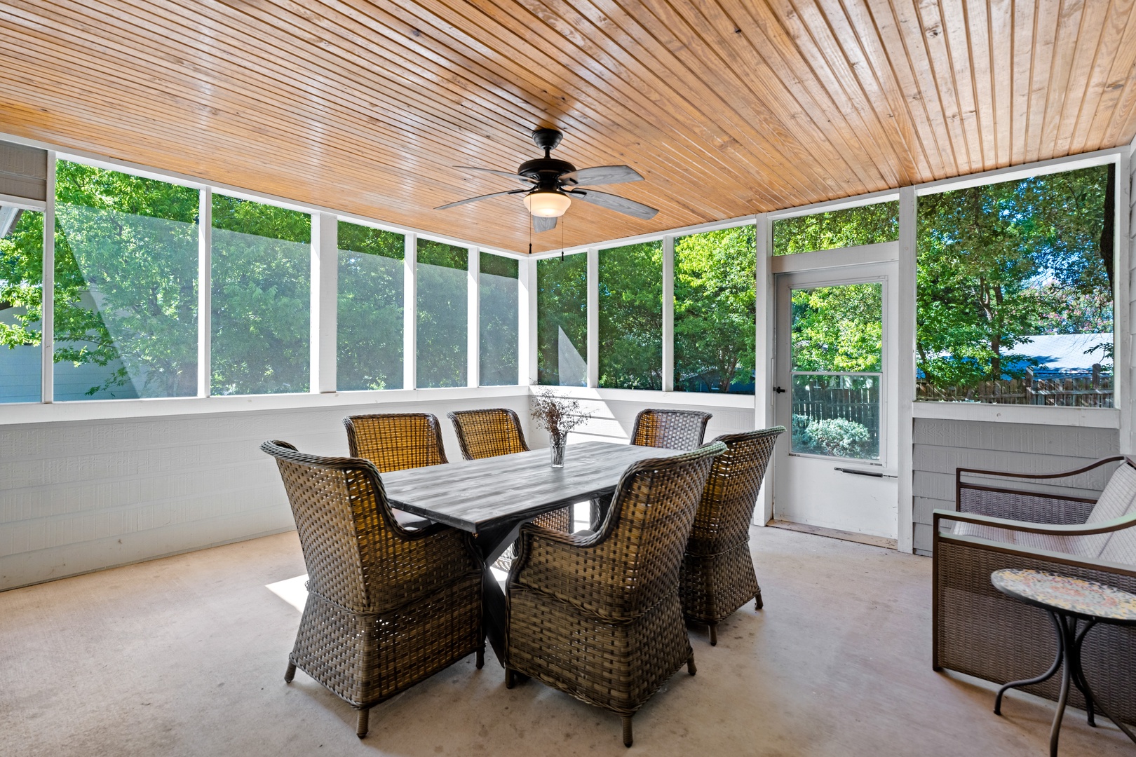 Screened porch with table and seating for 6