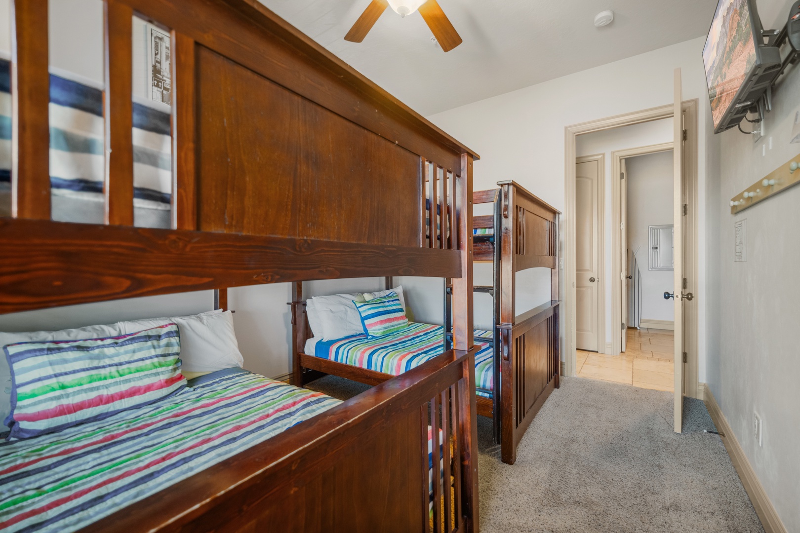 A pair of full-over-full bunkbeds & smart TV await in the final bedroom