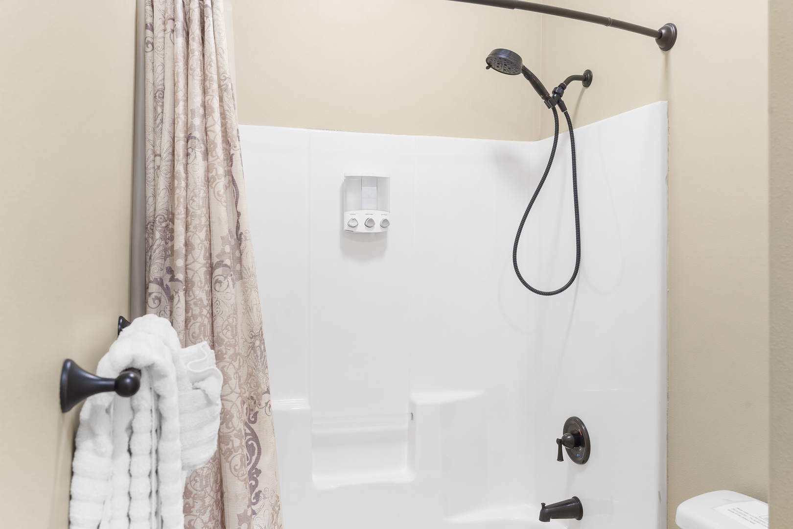 Dual vanities & a shower/tub combo await in the Jack & Jill bathroom