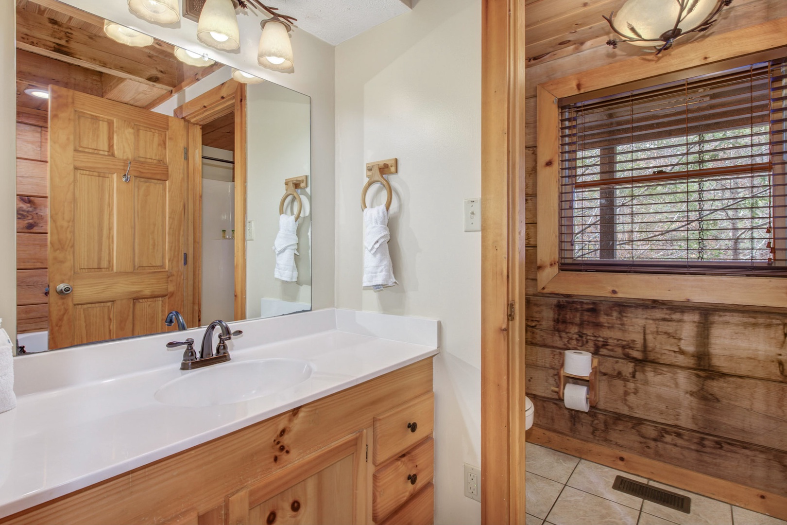The ensuite off the primary suite includes a large single vanity & shower