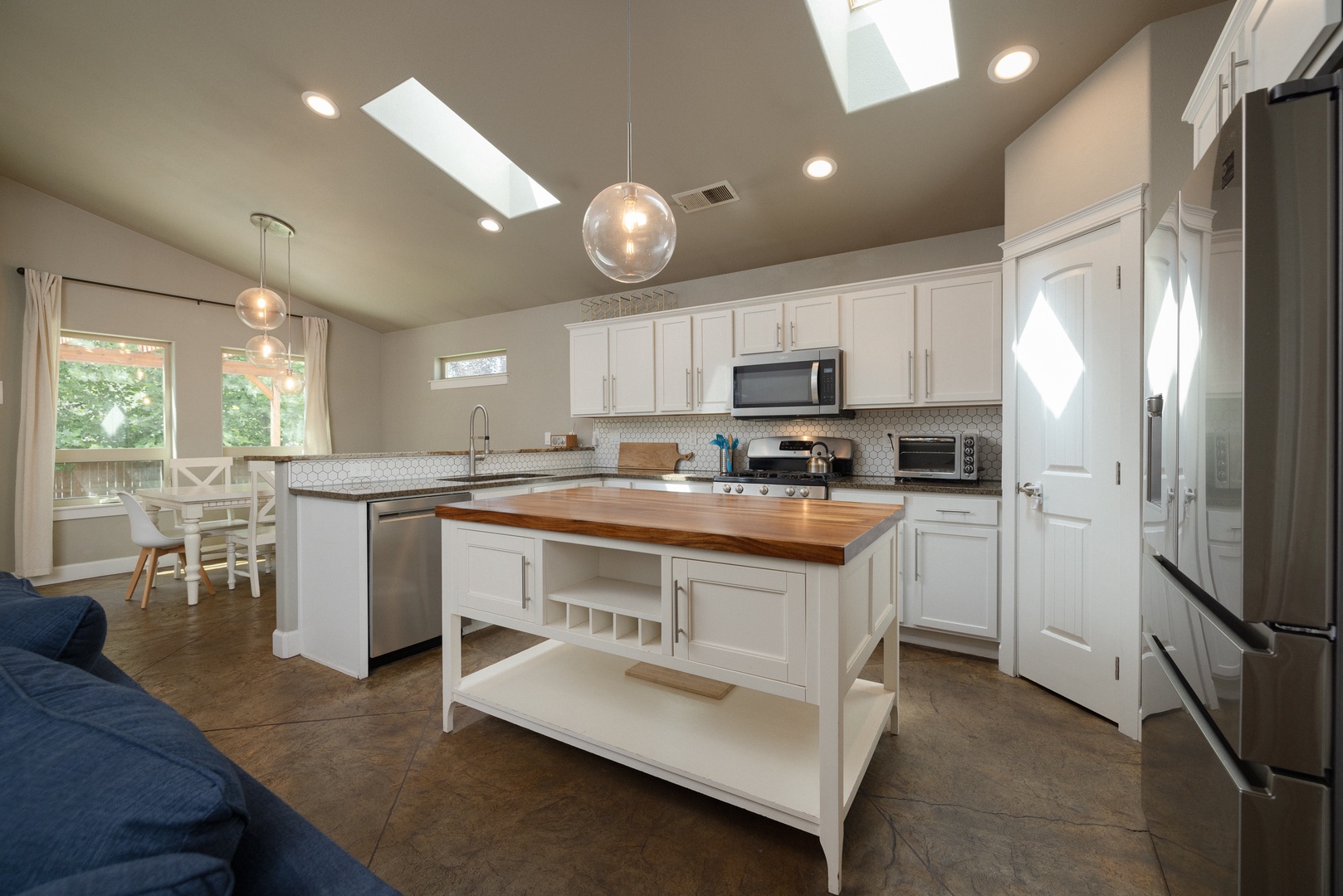 The cozy kitchen offers ample storage space & all the comforts of home