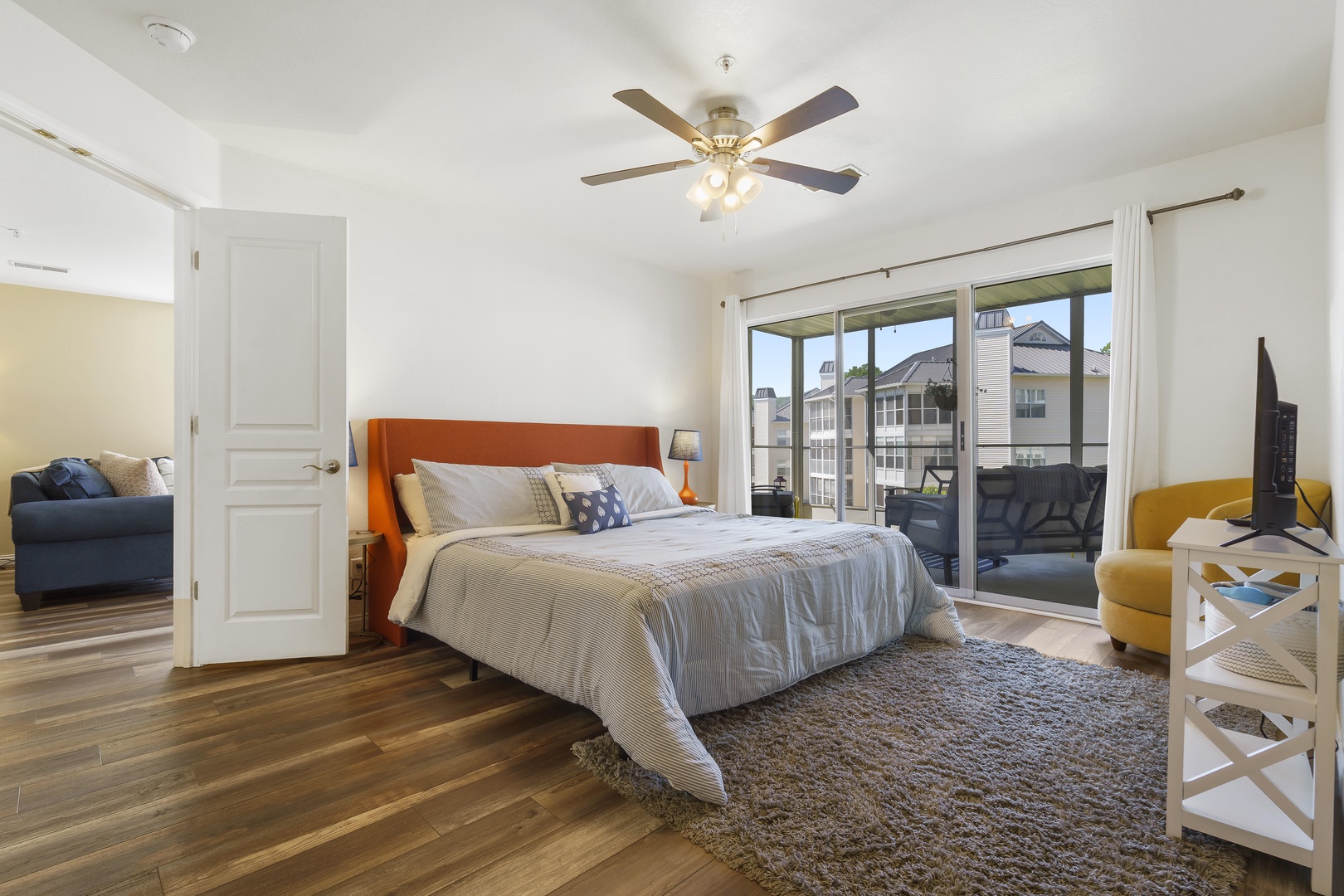 Bedroom 1 with King bed, balcony access, and private en-suite