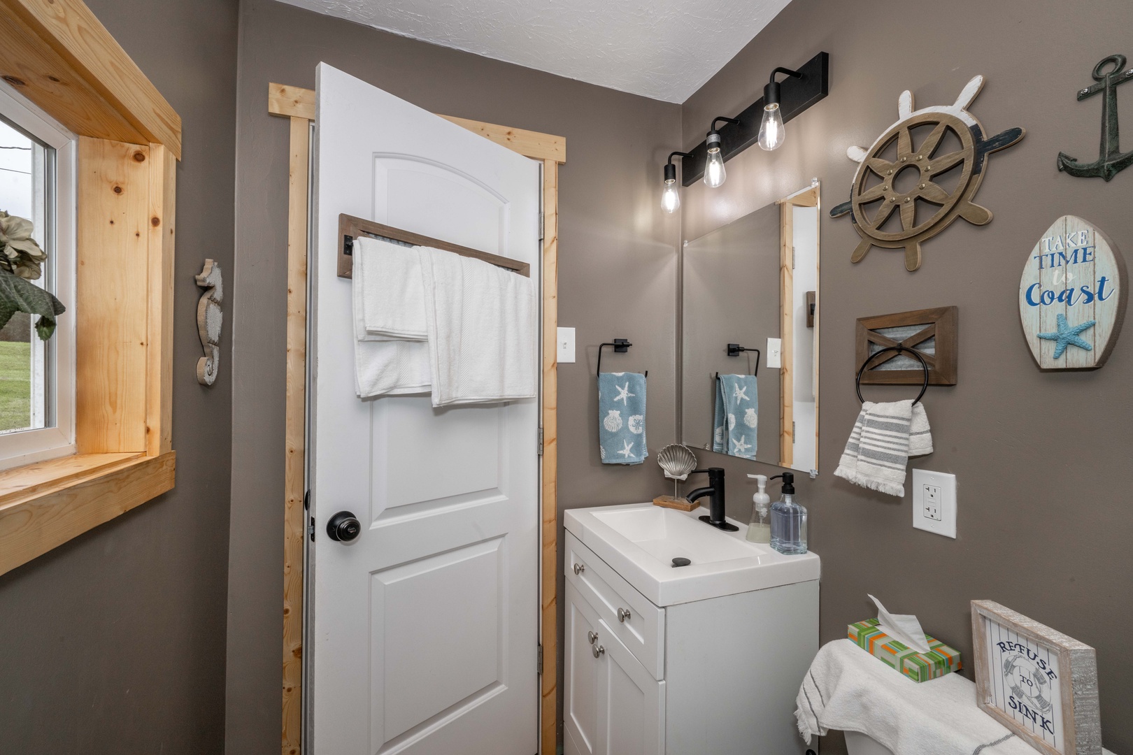 Wash up in the full bath, featuring a single vanity & shower/tub combo