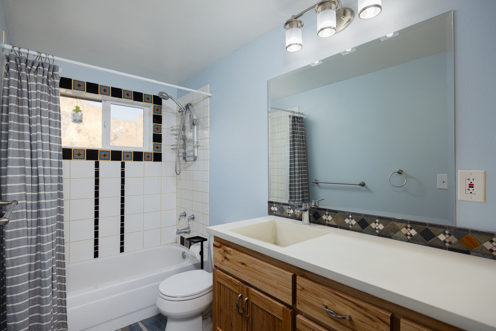 An oversized vanity & shower/tub combo await in the second full bath