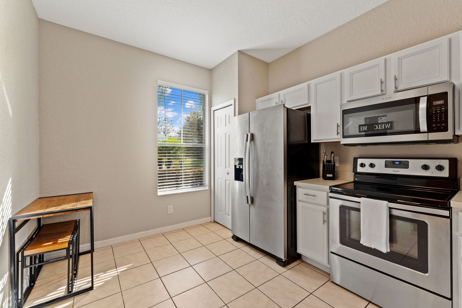 The bright, airy kitchen is well equipped with all the comforts of home