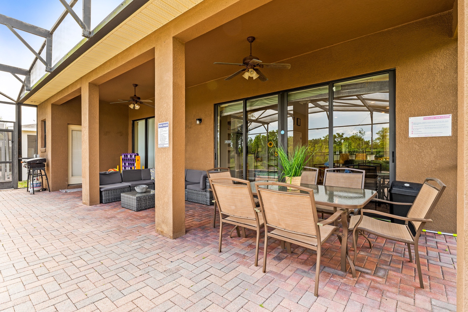 Private screened pool with outdoor seating, games & ceiling fans