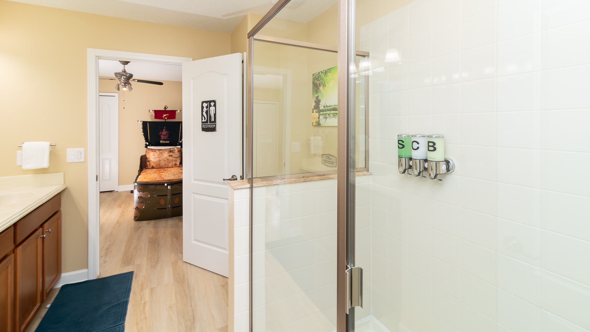 This Jack & Jill ensuite features a double vanity & glass shower