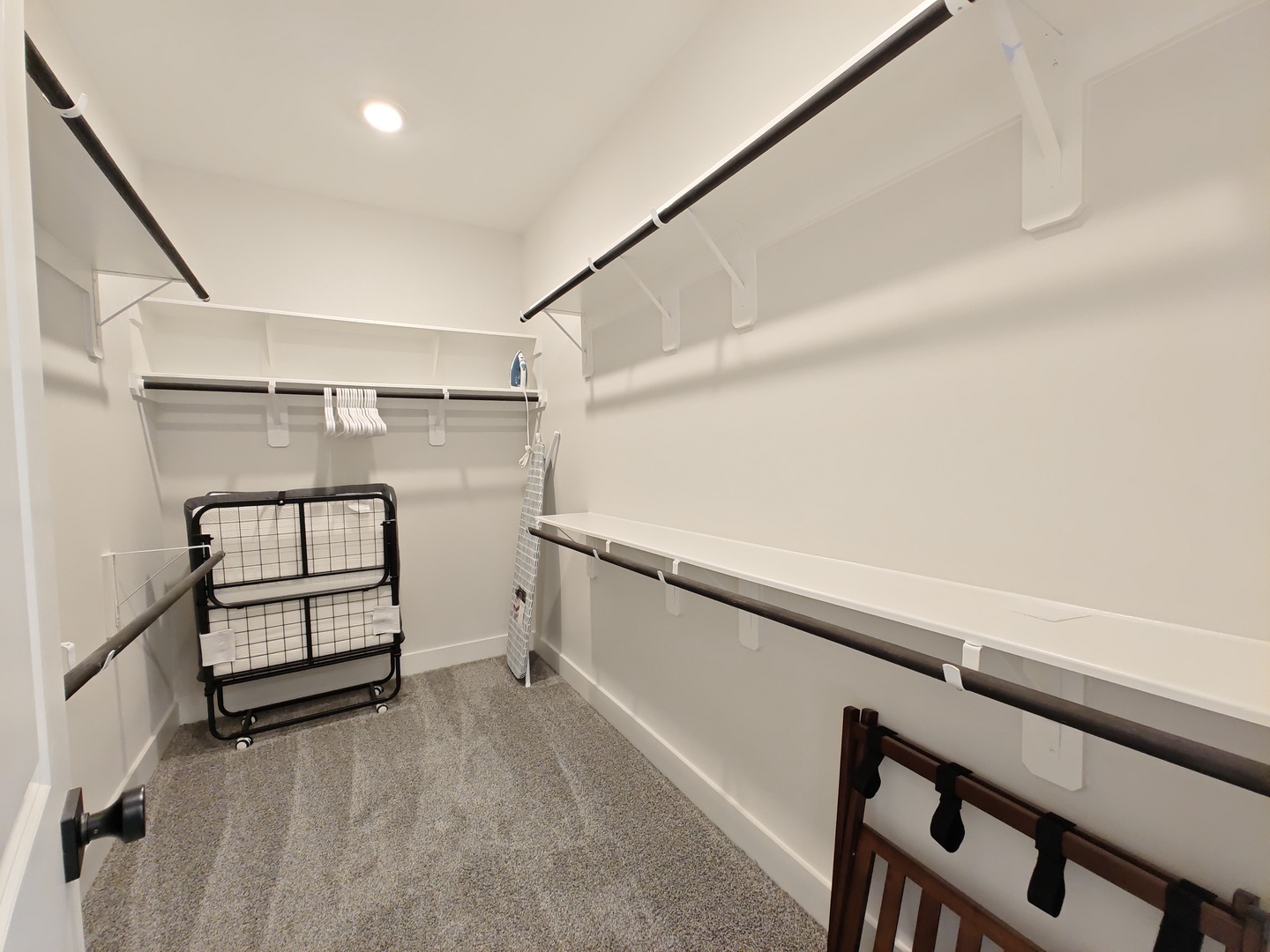 The king suite's walk-in closet offers a rollaway bed & lots of storage