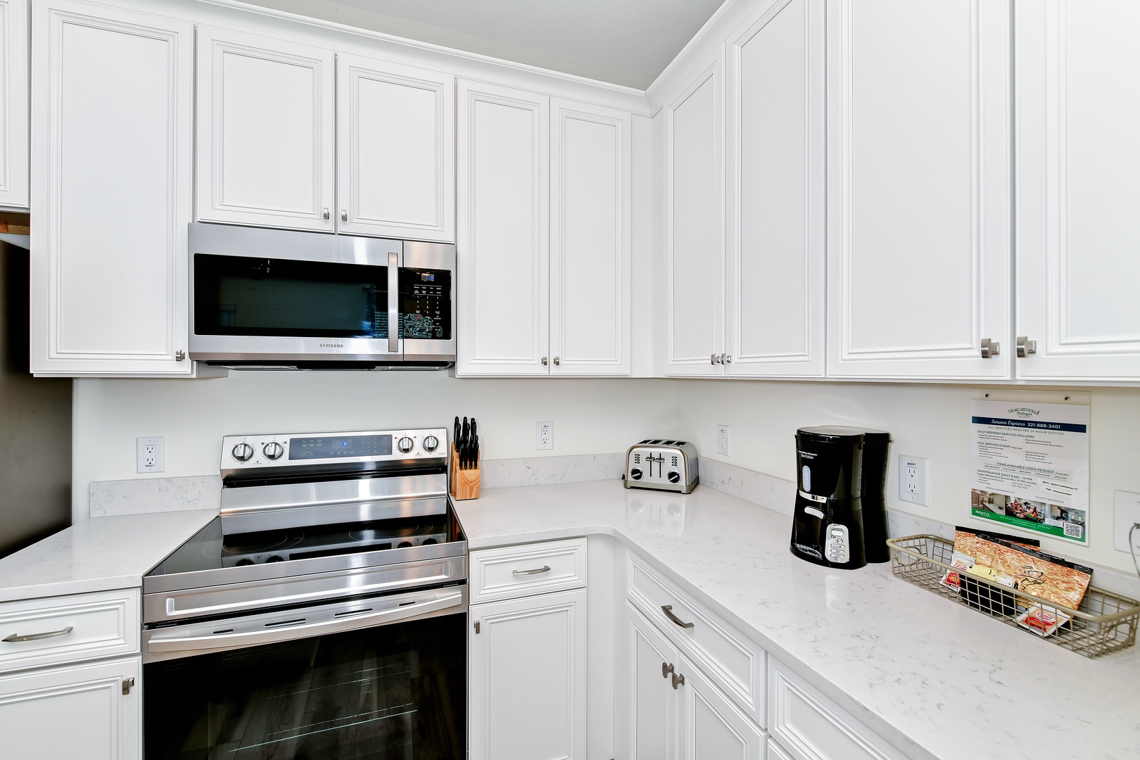 The kitchen offers ample storage space & all the comforts of home