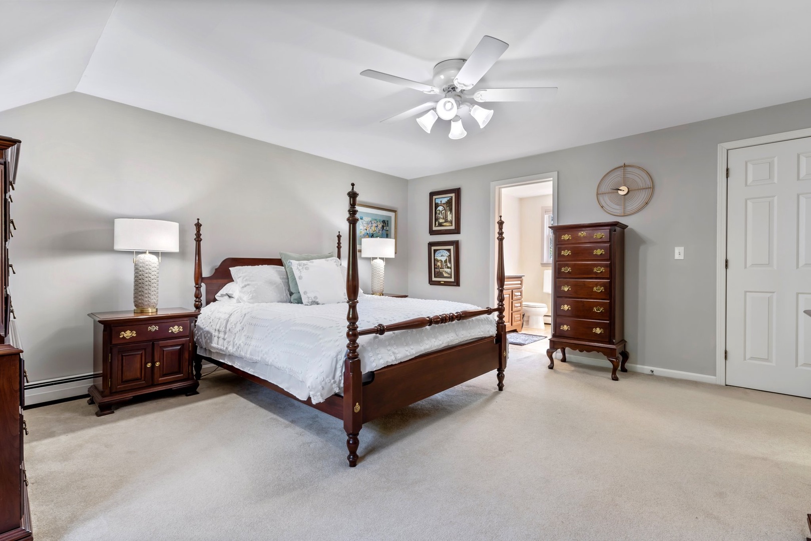 This cozy queen suite features a ceiling fan and private ensuite